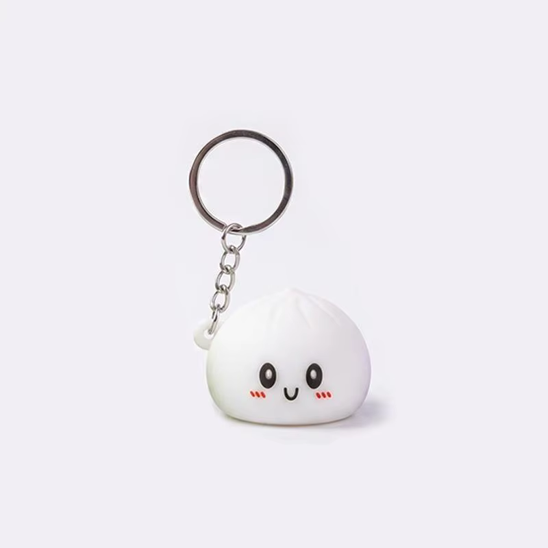 Porte-clés en silicone lumineux et adorable en forme de chignon, accessoire de dessin animé parfait