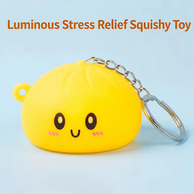 Porte-clés en silicone lumineux et adorable en forme de chignon, accessoire de dessin animé parfait pour le soulagement